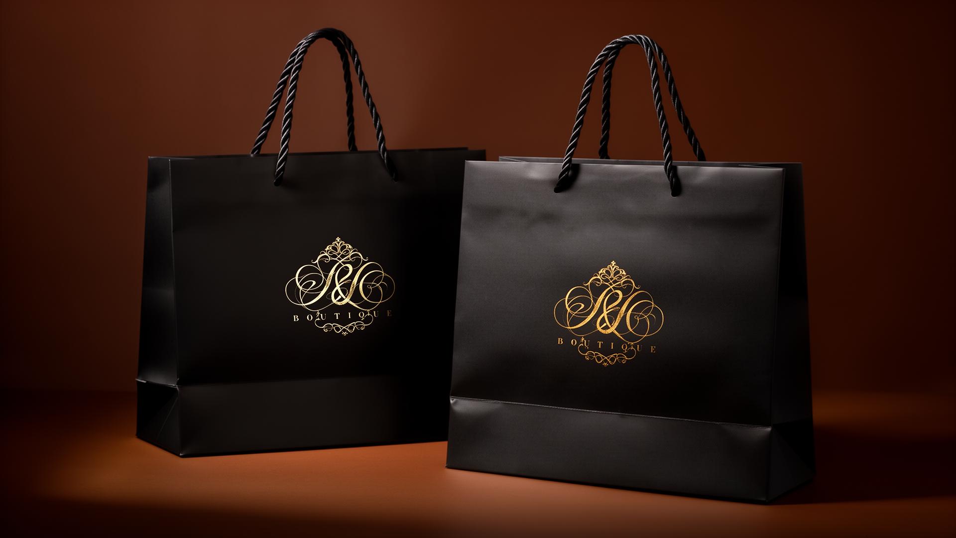 Sacolas de papel boutique pretas com logo dourado